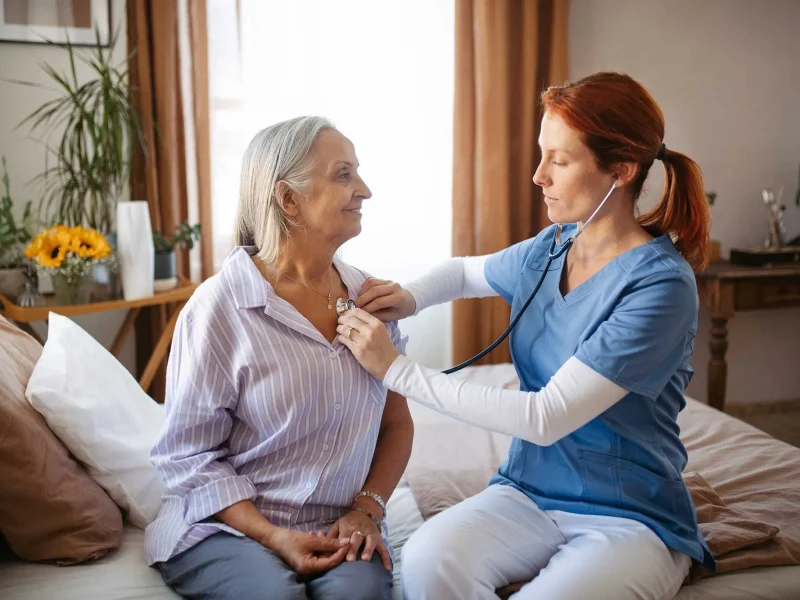 nurse-examining-senior-patient-with-stethoscope-at-2023-11-27-04-49-31-utc.webp